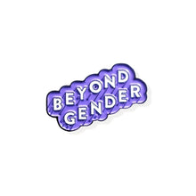 Load image into Gallery viewer, Enamel pin that reads &quot;BEYOND GENDER&quot; in white text angled diagonally upwards with a light purple border. 