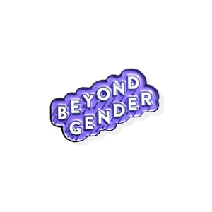 Enamel pin that reads "BEYOND GENDER" in white text angled diagonally upwards with a light purple border. 