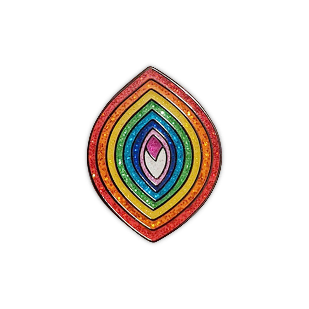 Enamel pin of a pointed oval with sparkly rainbow sections in a vagina shape. 