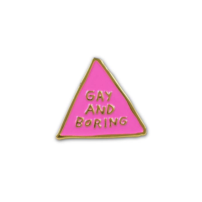 Enamel pin in the shape of a hand drawn pink triangle with a gold border, inside the triangle is text that reads 