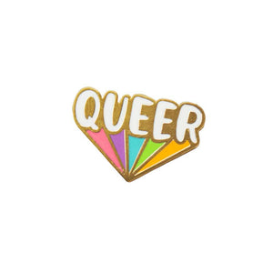 Gold enamel pin that reads "QUEER" in white lettering underneath is rainbow colors coming off the text. 